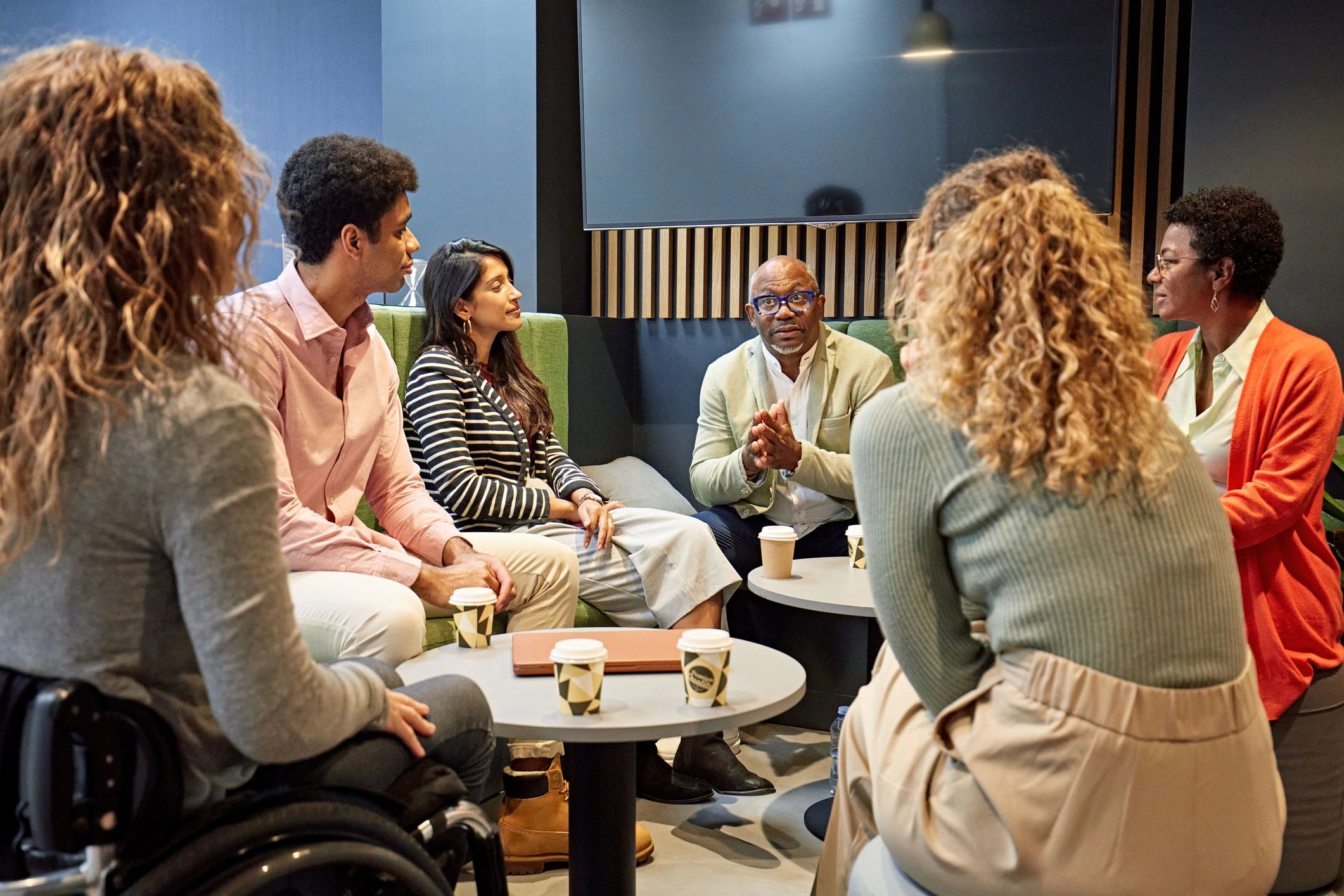 Community members meeting in a small group